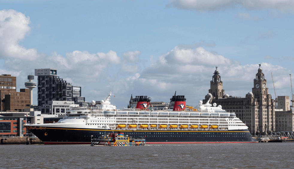 A Disney Cruise ship on Liverpool Waterfront in front of the Three Graces