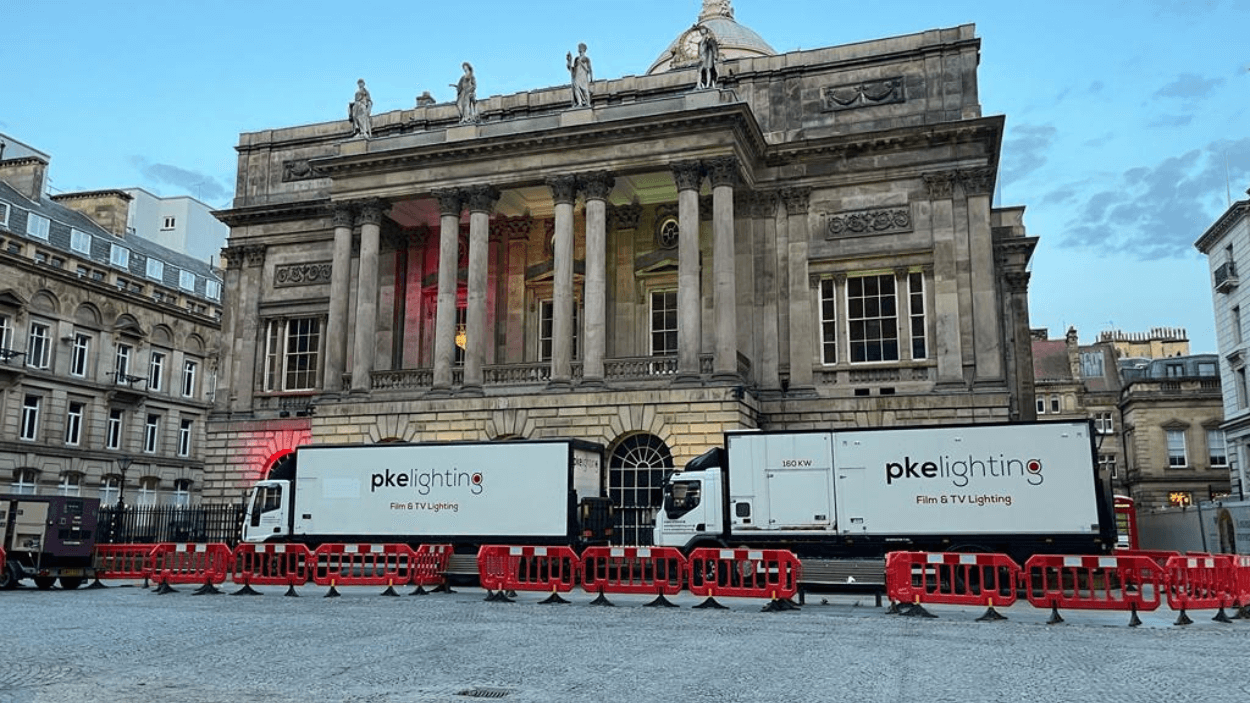 Liverpool Town Hall with filming trucks outisde.