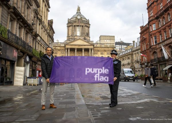 LIVERPOOL, ENGLAND. Councillor Abdul Qadir, Cabinet Member for Neighbourhoods and Community Safety, poses for a photograph with Merseyside Police’s City Centre Inspector, Charlotte Irlam, shortly after Liverpool received Purple Flag status for the twelfth year in a row. 9 February 2022. Picture: Jennifer Bruce/Liverpool City Council.